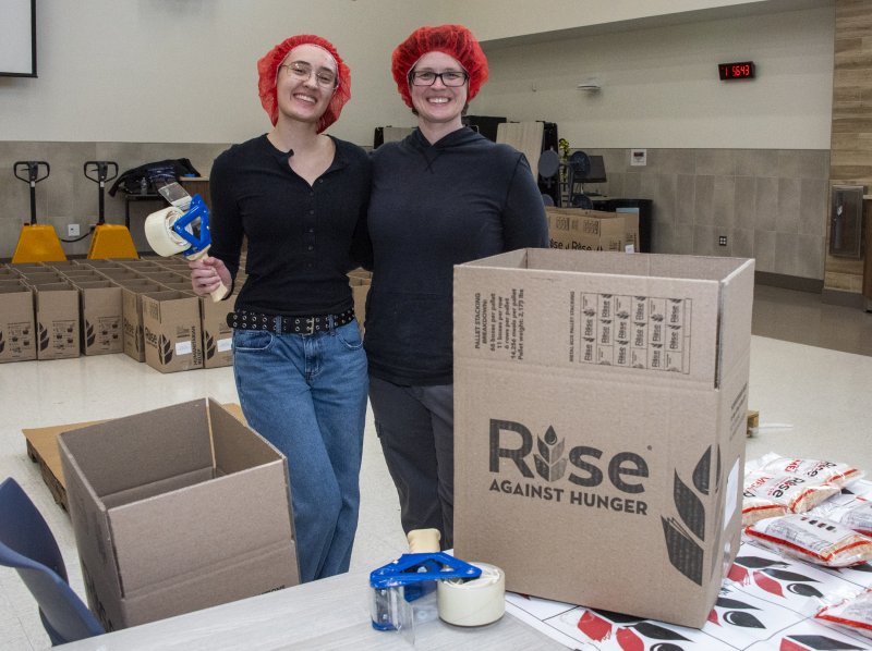 Bee and Beth Weaver-Ronk are ready to seal the packages for shipping.